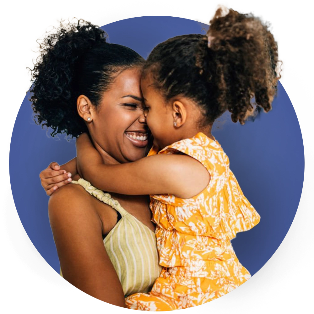 Mother holding daughter, smiling